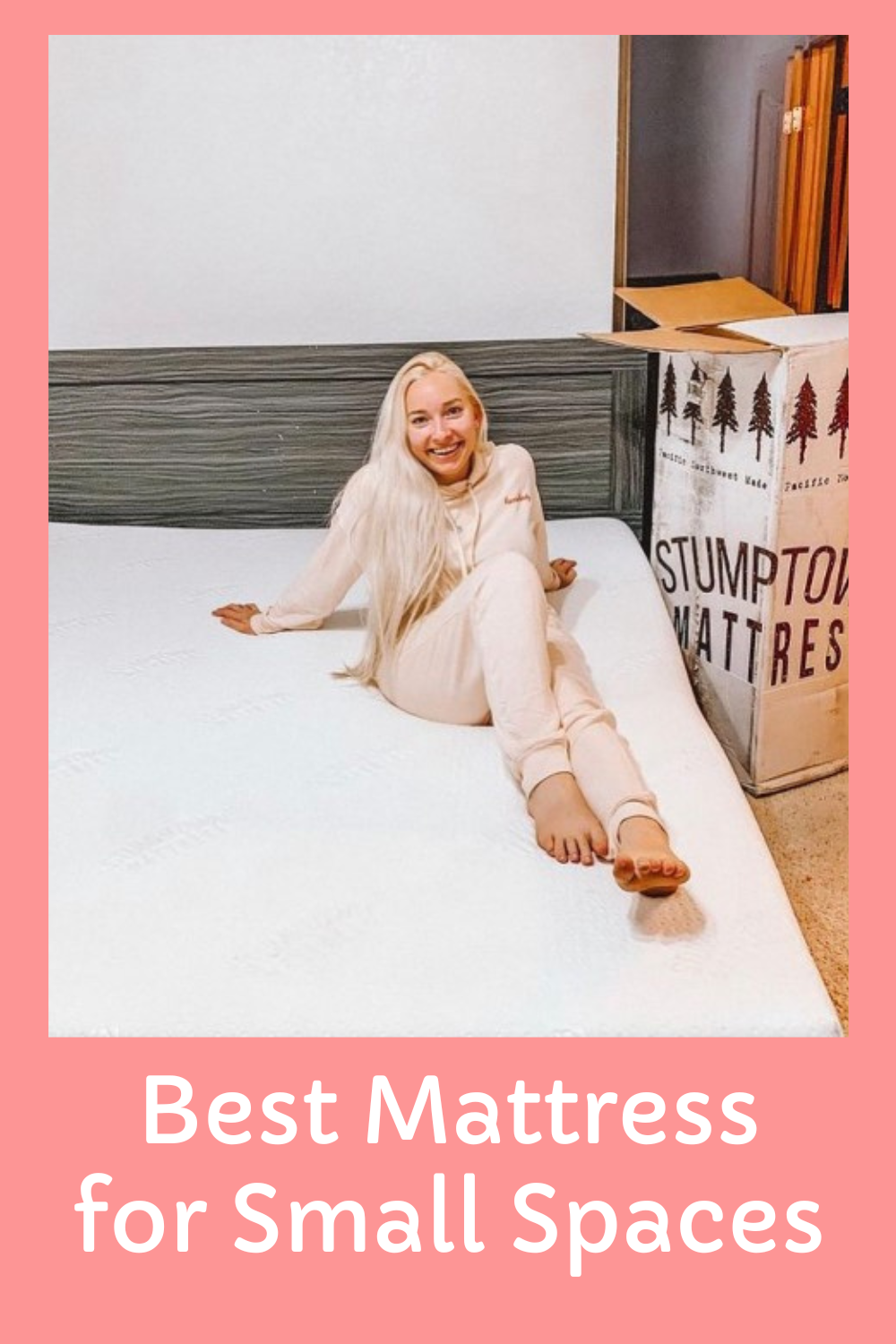 Happy customer sits on the best mattress for a condo or apartment